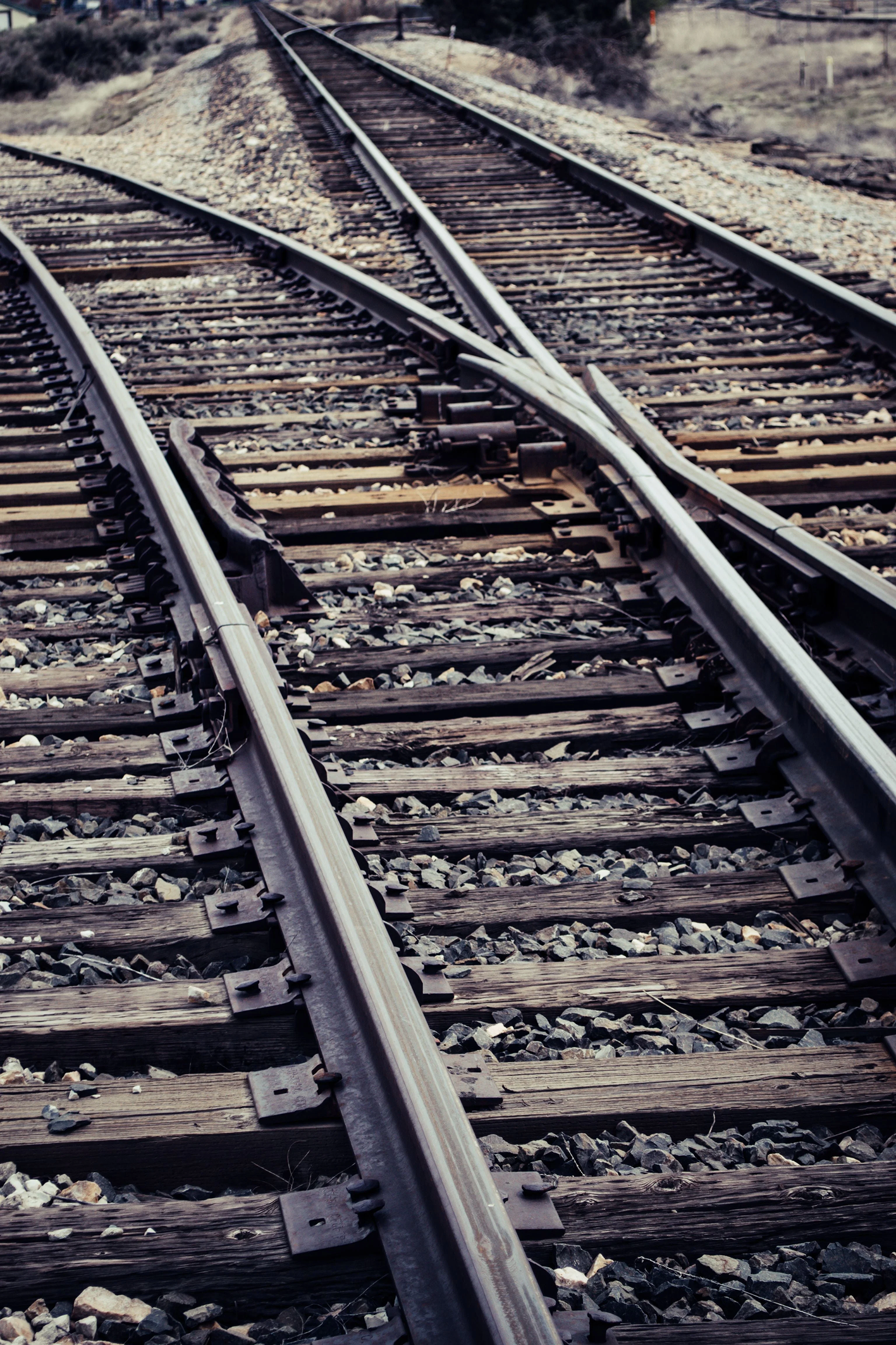 Railroad tracks splitting and shifting into different directions.