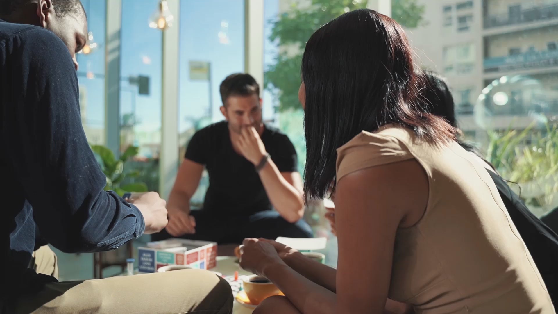 Load video: A group of friends talking around a table