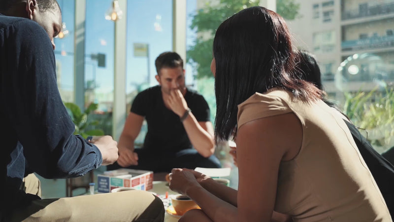 A group of friends talking around a table